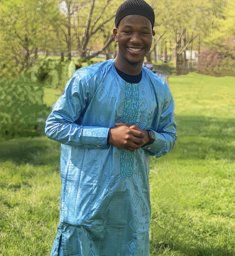 Smiling Student in Traditional African Garb